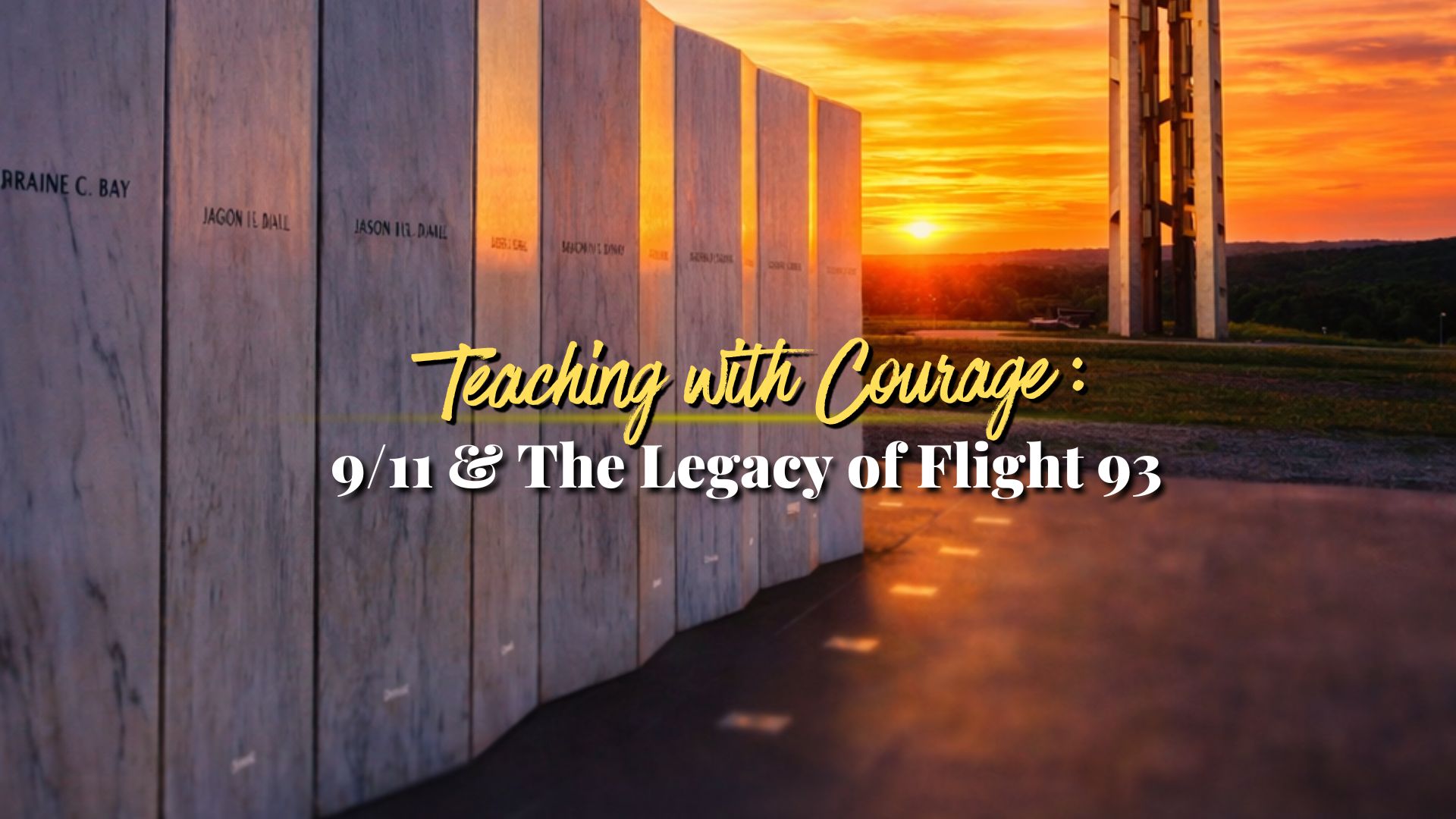 A picture of white marble wall and a tower with a sunset in the background.